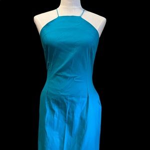 Stretch fit teal dress. Halter neck with satin cord straps.
